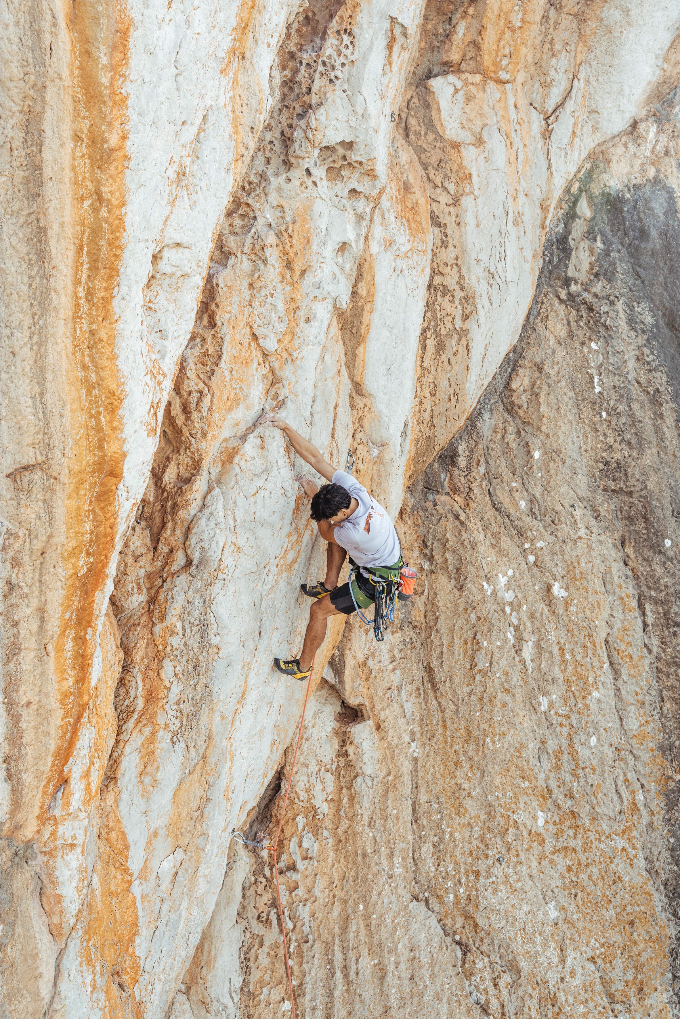 Person rock climbing with the lavender the reation of adventure tshirt by vertical vibes
