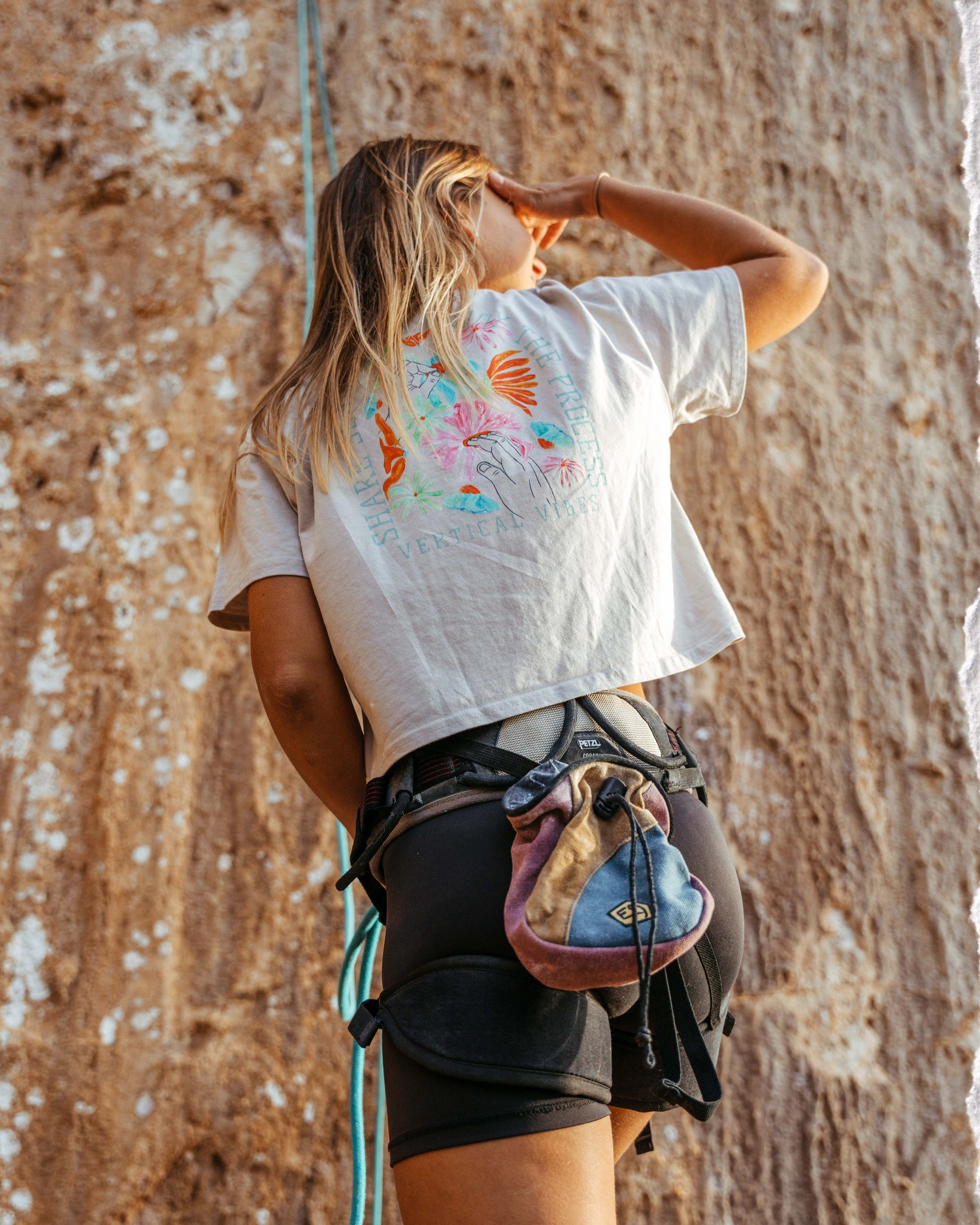 Women outside preparing for climbing in beige - sharing love crop top by vertical vibes